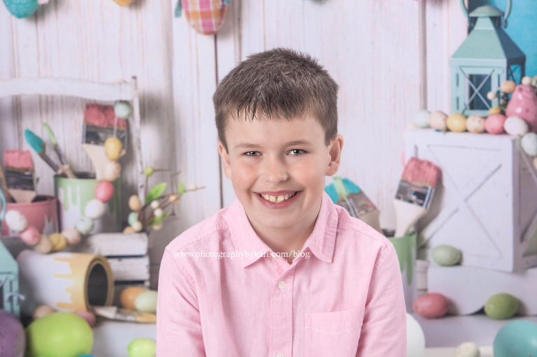 Easter portrait of boy in a pink shirt