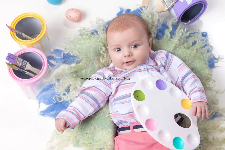 Easter portrait of baby boy iwith paint pallette