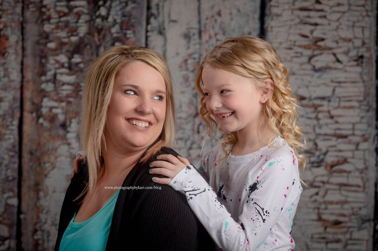 Mother and daughter looking and smiling at each other
