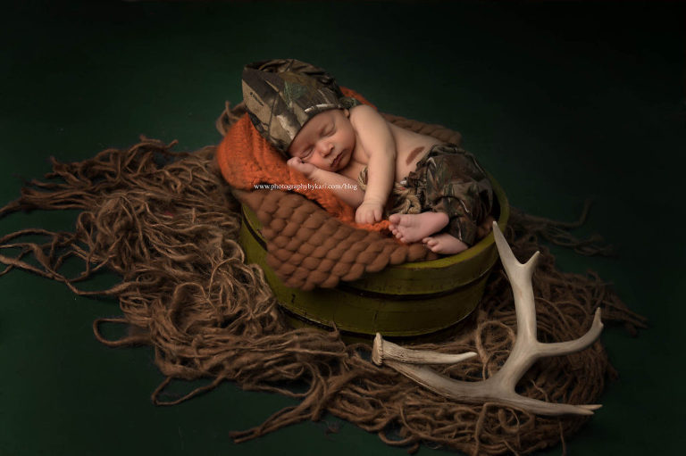 newborn boy with camo and antlers