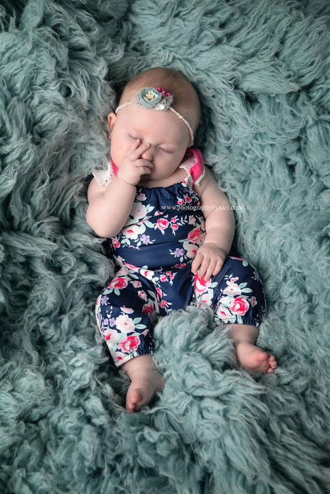 sleeping 3 month old girl studio portrait
