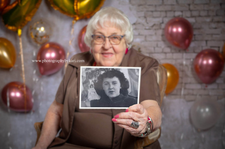 ellen mcgill holding old photo of herself photographed by Kari McGill