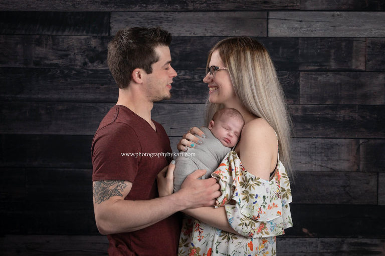newborn with parents portrait
