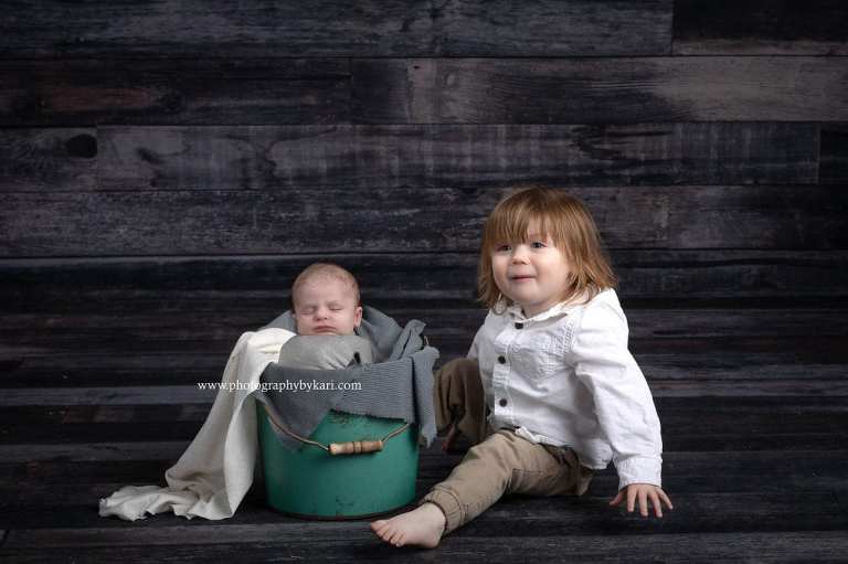 newborn with toddler big brother portrait