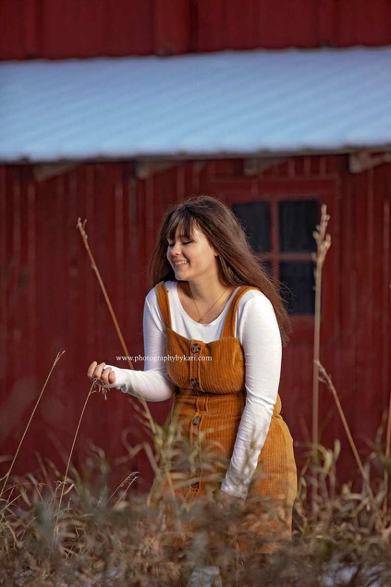 Senior portrait in Minnesota  laughing in tall grass