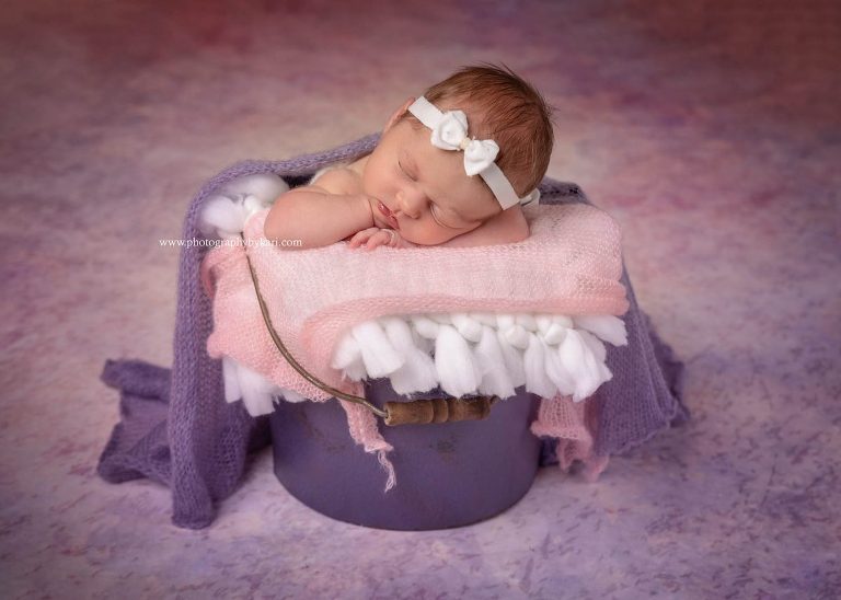 Grand Meadow Newborn girl portrait in bucket