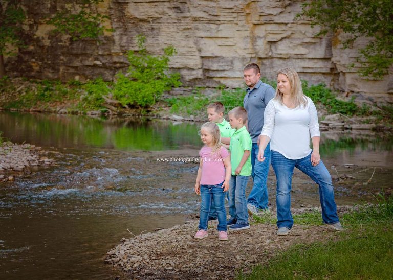 mn family portrait sessionthrowing rocks at Masonic Park in Spring Valley, MN