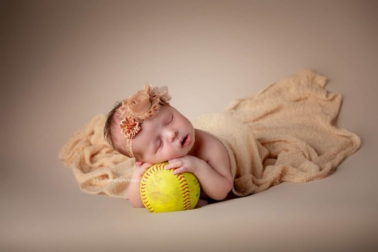MN Newborn girl portrait with softball