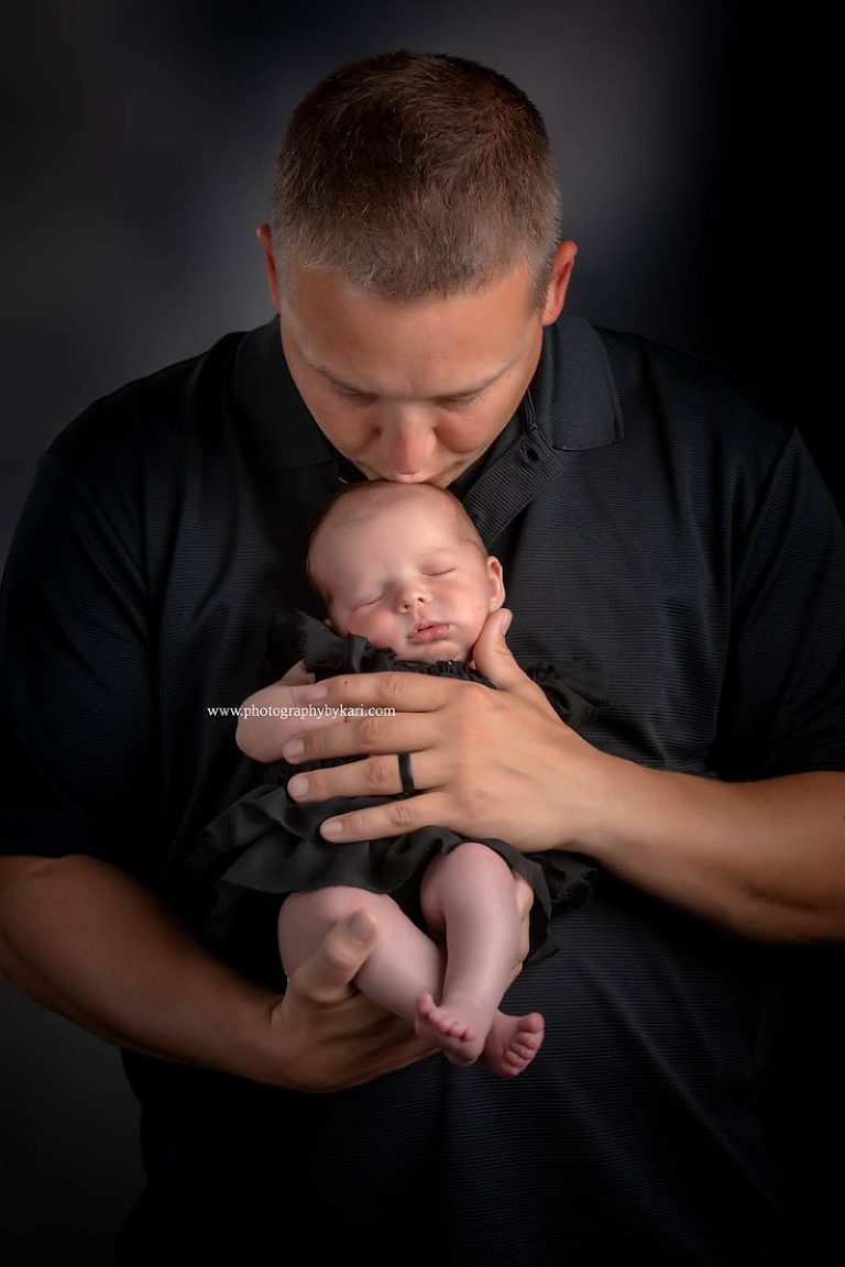 MN Newborn girl portrait with Dad kising head