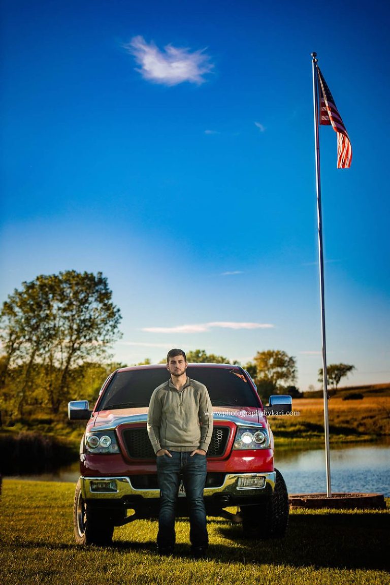 mn senior guy portrait with truck and flag