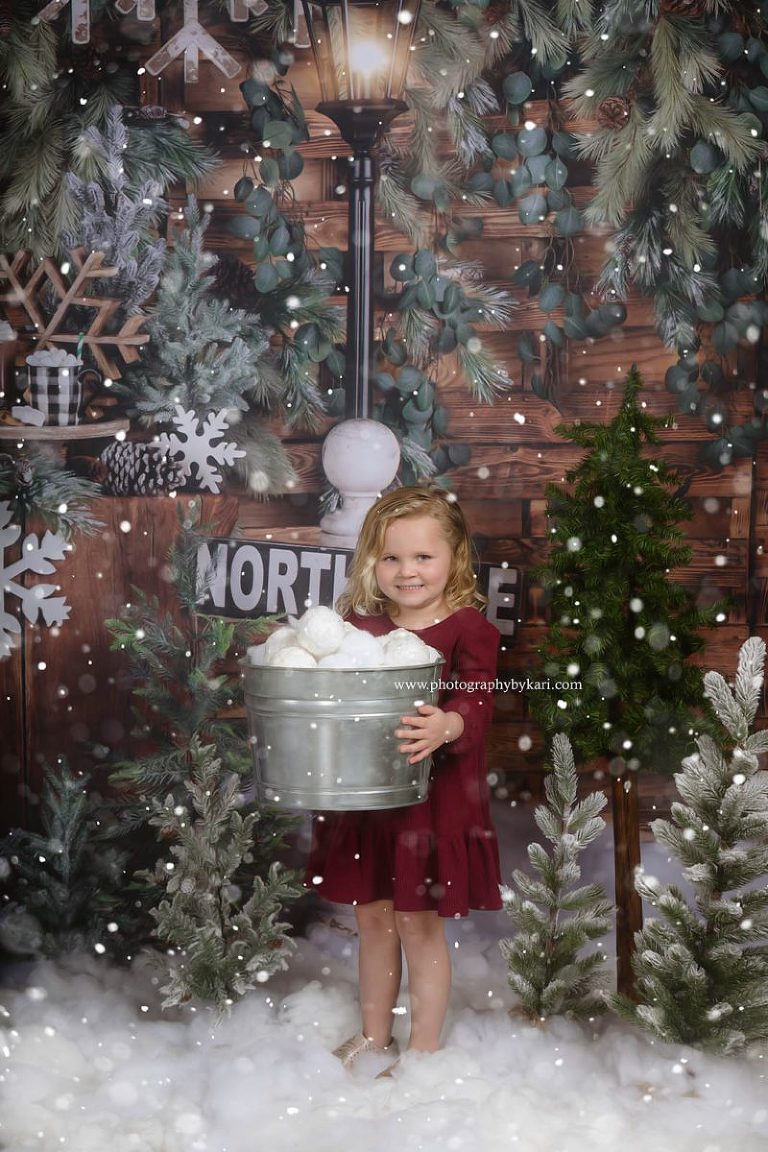 MN Christmas Mini girl holding bucket of snow balls
