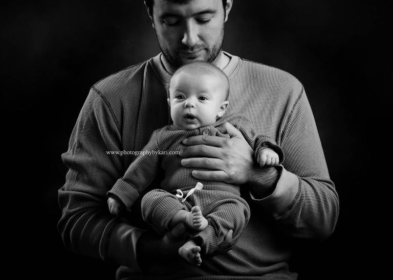 Minnesota Newborn photography newborn in dad's hands