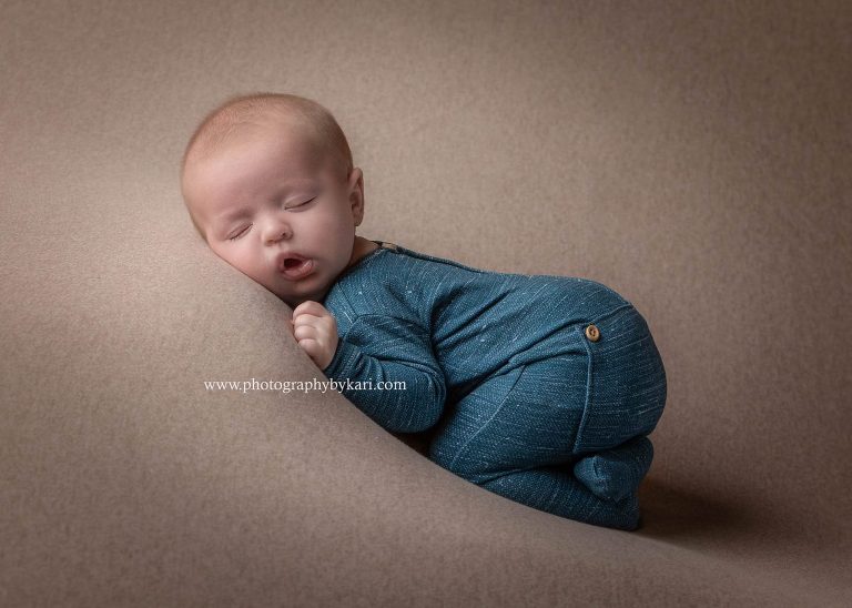 Minnesota Newborn photography of newborn in blue on brown drop