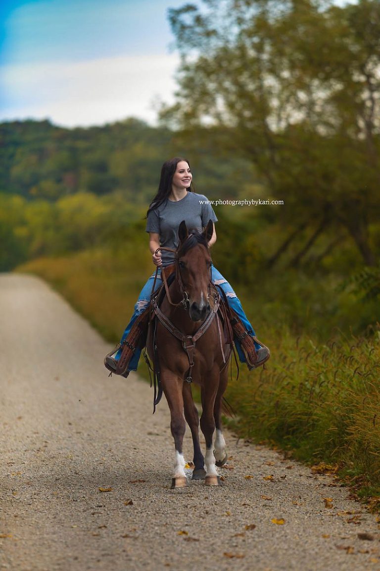 Senior Portrait of senior riding horse at forestville state park\