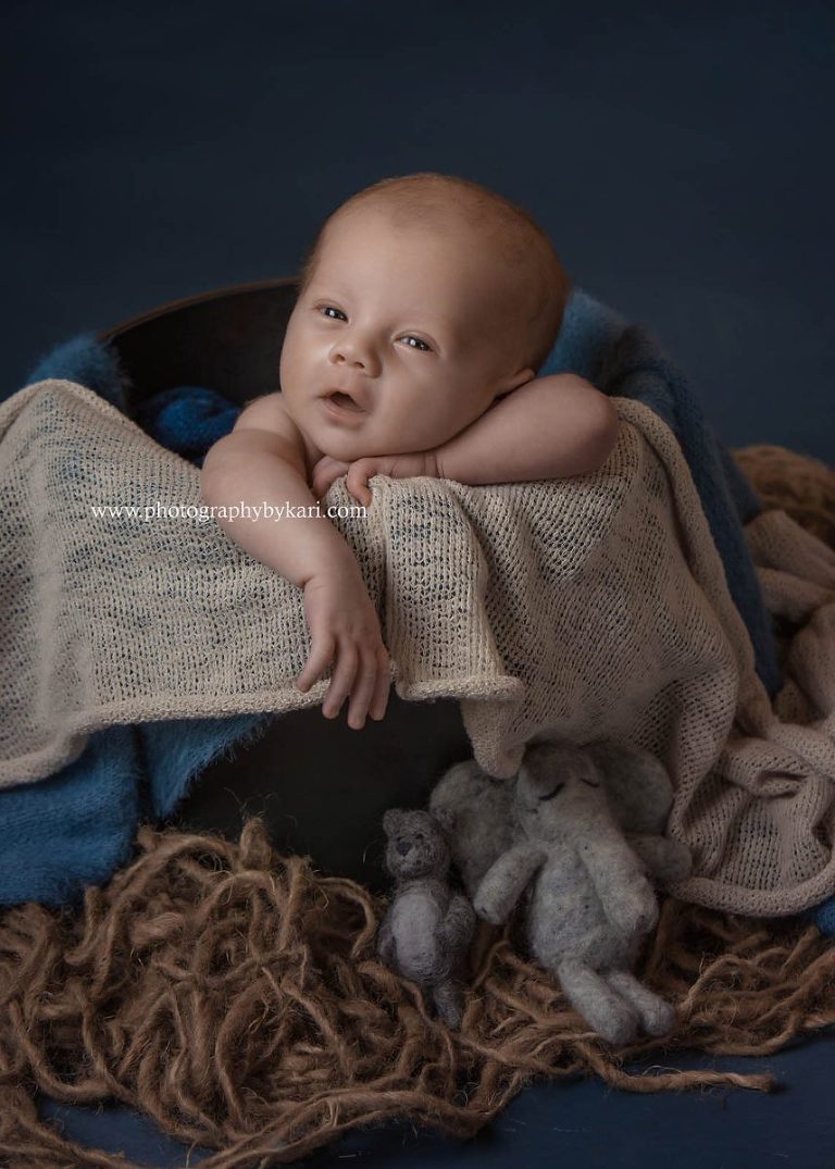 Newborn Portrait photograph  of boy in bucket