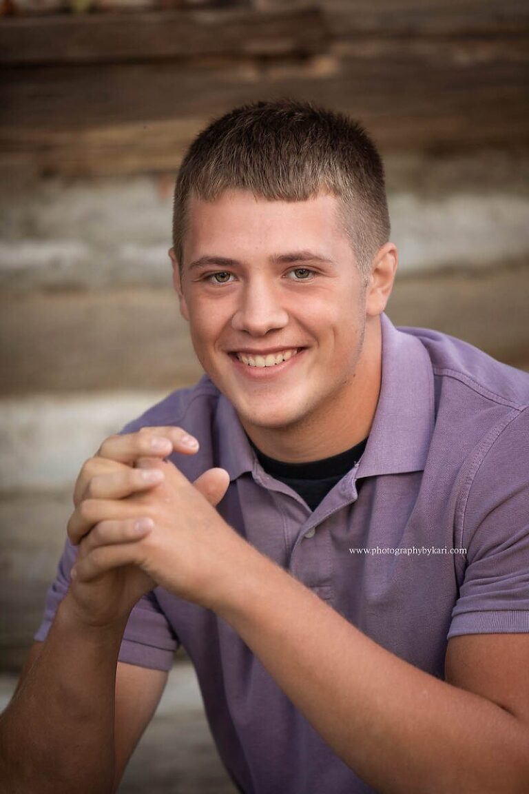 Mason poses casually for his MN senior pictures.