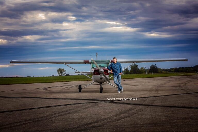 Mason with his airplane MN senior pictures.