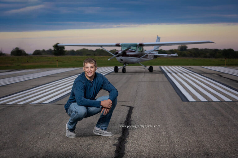 Mason with his airplane MN senior pictures.