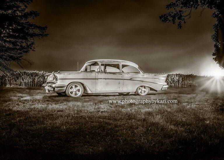 Light painted car in front of corn field taken by Photography by Kari