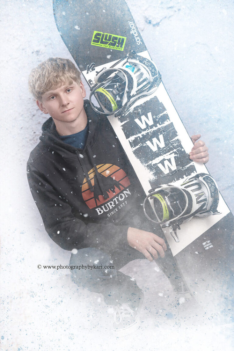 Senior pictures with snowboard in Spring Valley MN