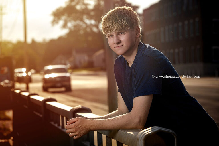 Senior portrait of boy in downtown Spring Valley Minnesota