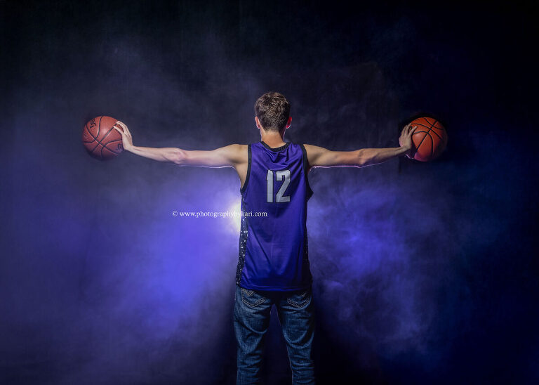 Senior boy basketball portrait with smoke and colored gels in studio