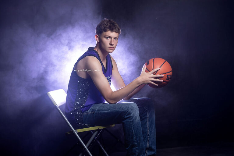 Grand Meadow senior basketball photo taken in studio with creative lighting