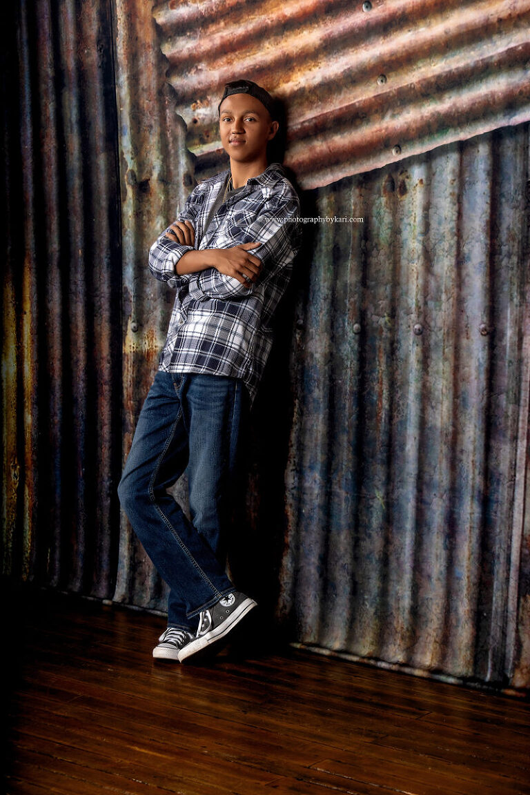 2025 senior photo session with studio lighting and backdrop