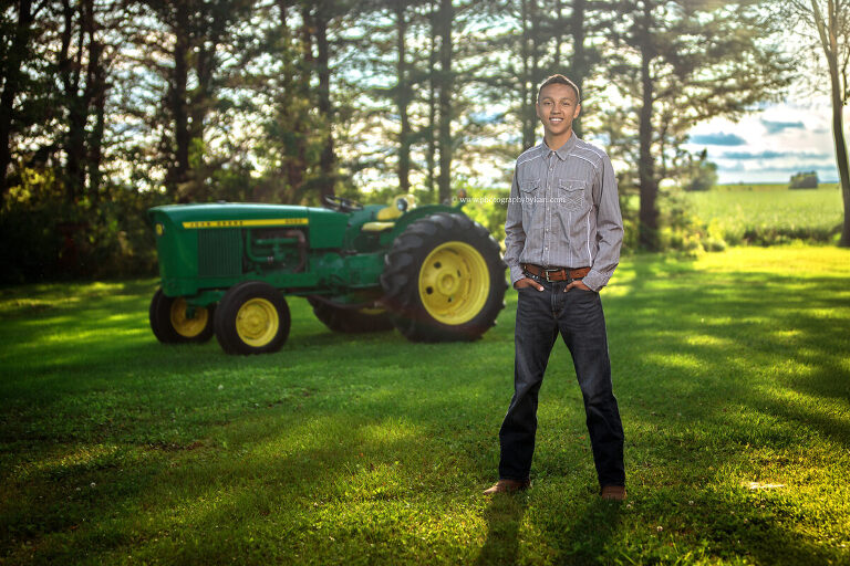 Kingsland senior photo on rural Minnesota farm with tractor