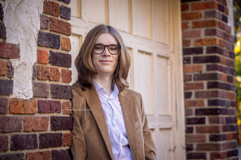Classic senior portrait with stone architecture at Plummer House"
