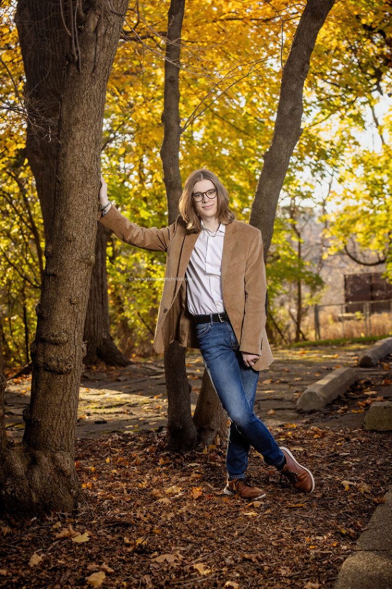 Mayo High School senior boy posing at Plummer House in Rochester MN