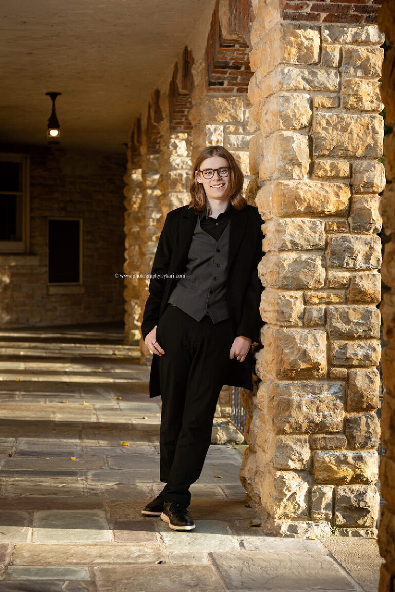 Classic senior portrait with stone architecture at Plummer House