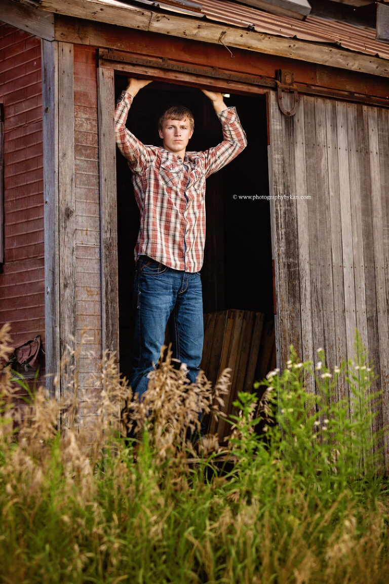 Kingsland senior boy photographed outdoors on family land
