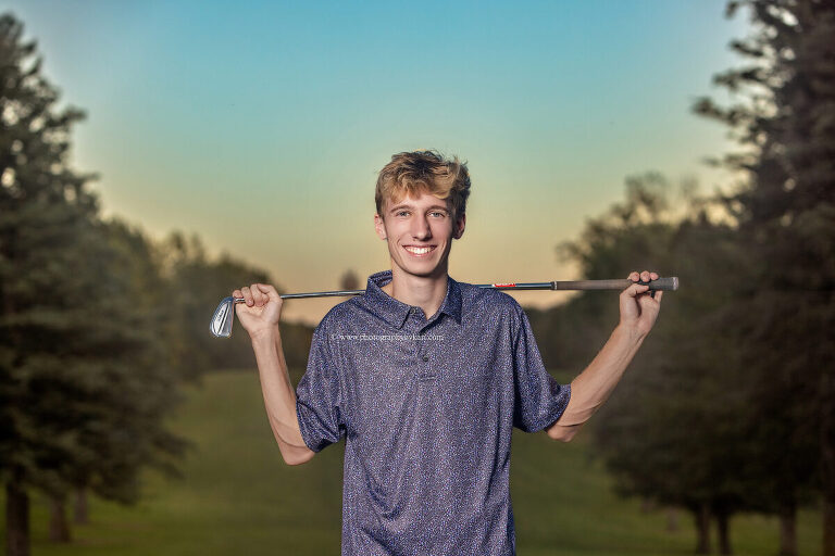 Senior boy at sunset on bluff-top golf course in Lanesboro MN"