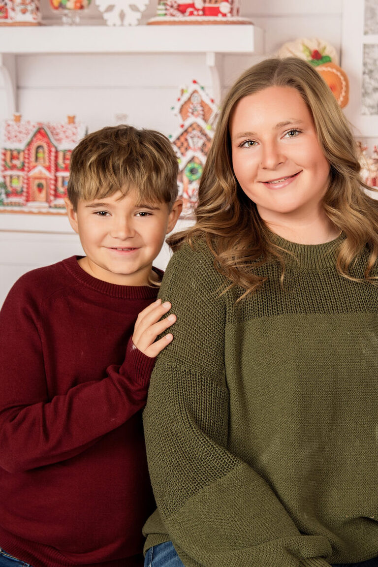 Sentimental mom and son Christmas photos with gingerbread baking theme in Minnesota