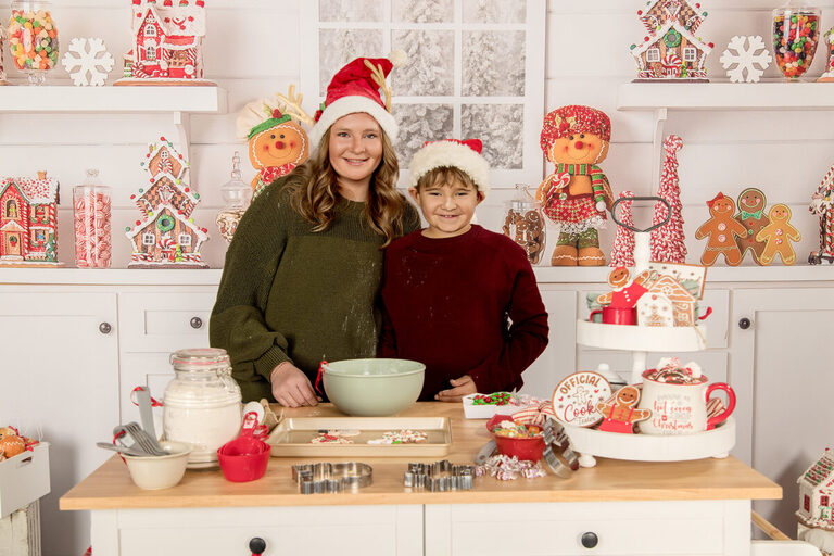 Holiday mini session featuring mother and son baking cookies in photography studio Spring Valley MN