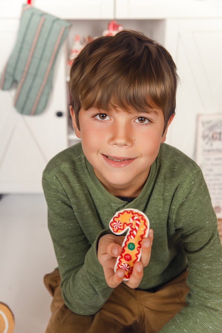 Kids laughing and baking cookies during gingerbread Christmas mini session SEMN