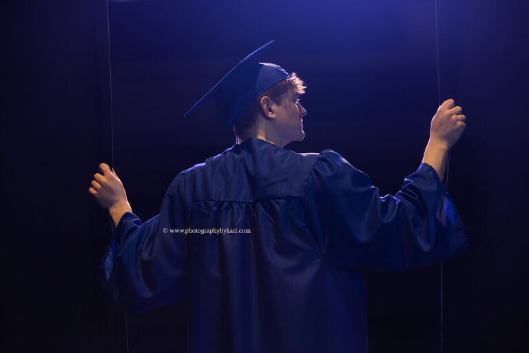 Cap and gown portrait in Southland High School auditorium