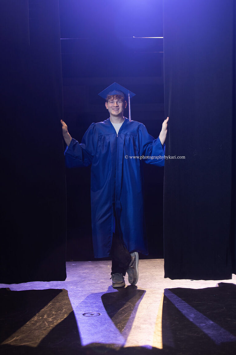Cap and gown portrait in Southland High School auditorium