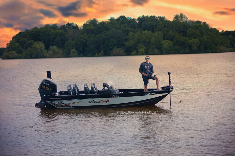 Senior portrait with family boat on Cedar Lake