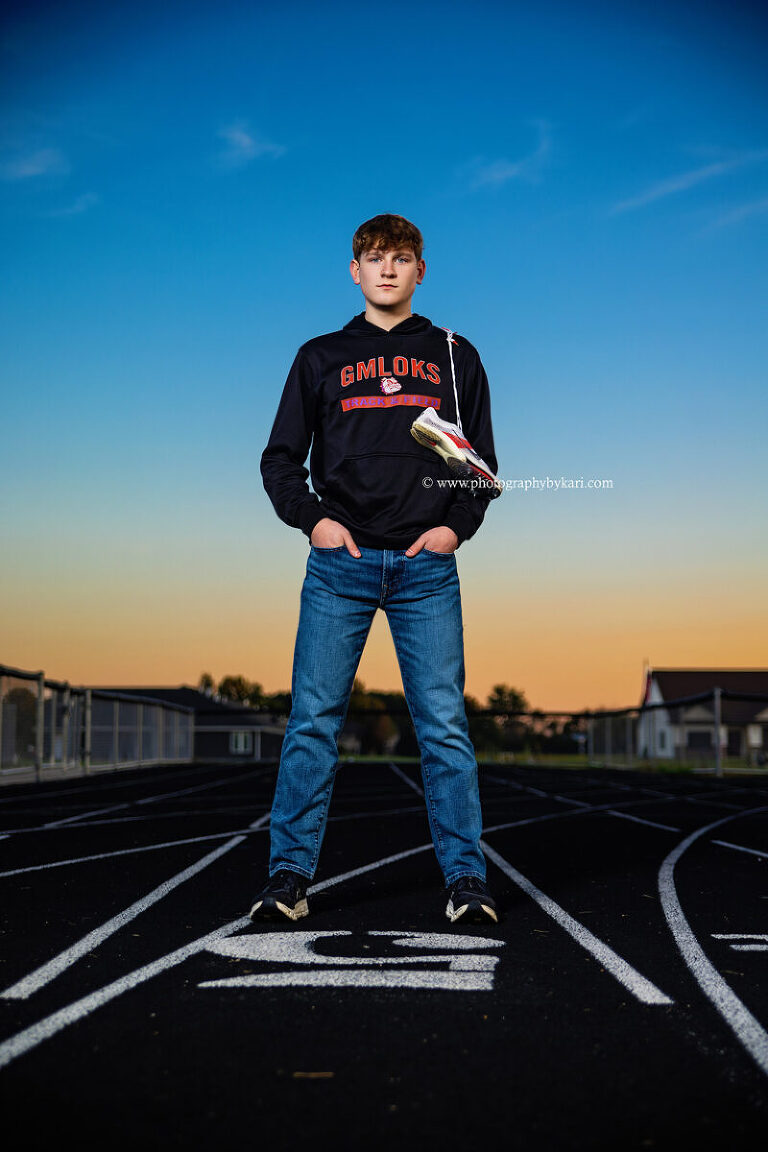 Southland senior athlete posing at Grand Meadow High School track