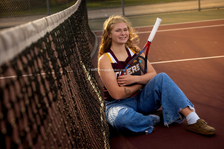 Senior girl on Stewartville High School tennis courts