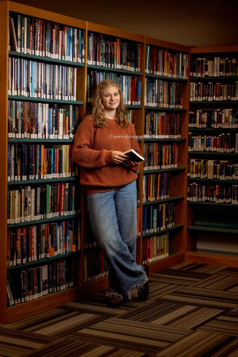 Book lover senior portrait inside local library