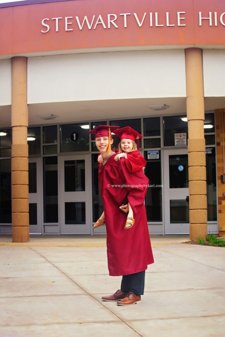 Sibling milestone portrait celebrating graduation and preschool