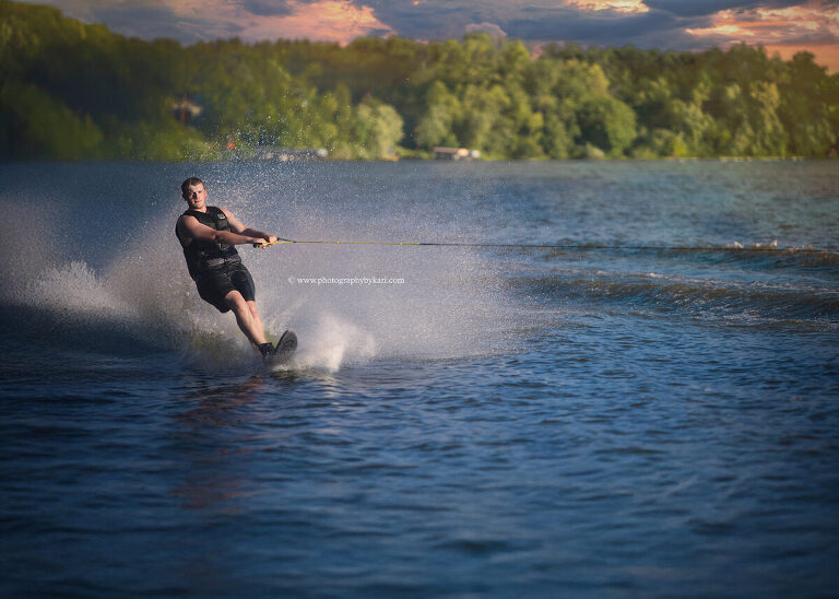 Senior boy waterskiing during summer photo session