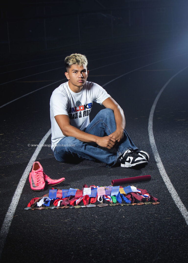 Nathaniel at the Grand Meadow track and field during the final light of his senior session