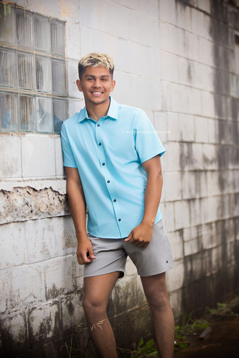 Nathaniel outdoors in downtown Spring Valley during his senior photo session