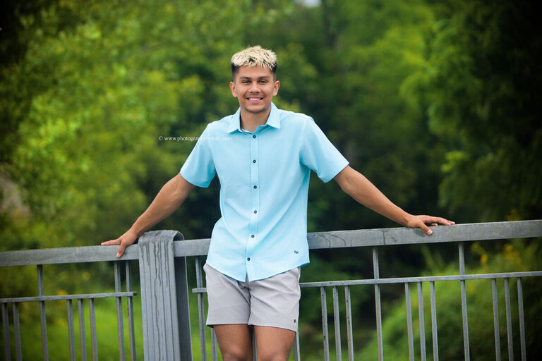 Nathaniel smiling during his senior portrait session in downtown Spring Valley, Minnesota.